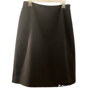 Ann Taylor skirt, fully lined. A-Line.,Black. Pleats in back at hem. Never worn.